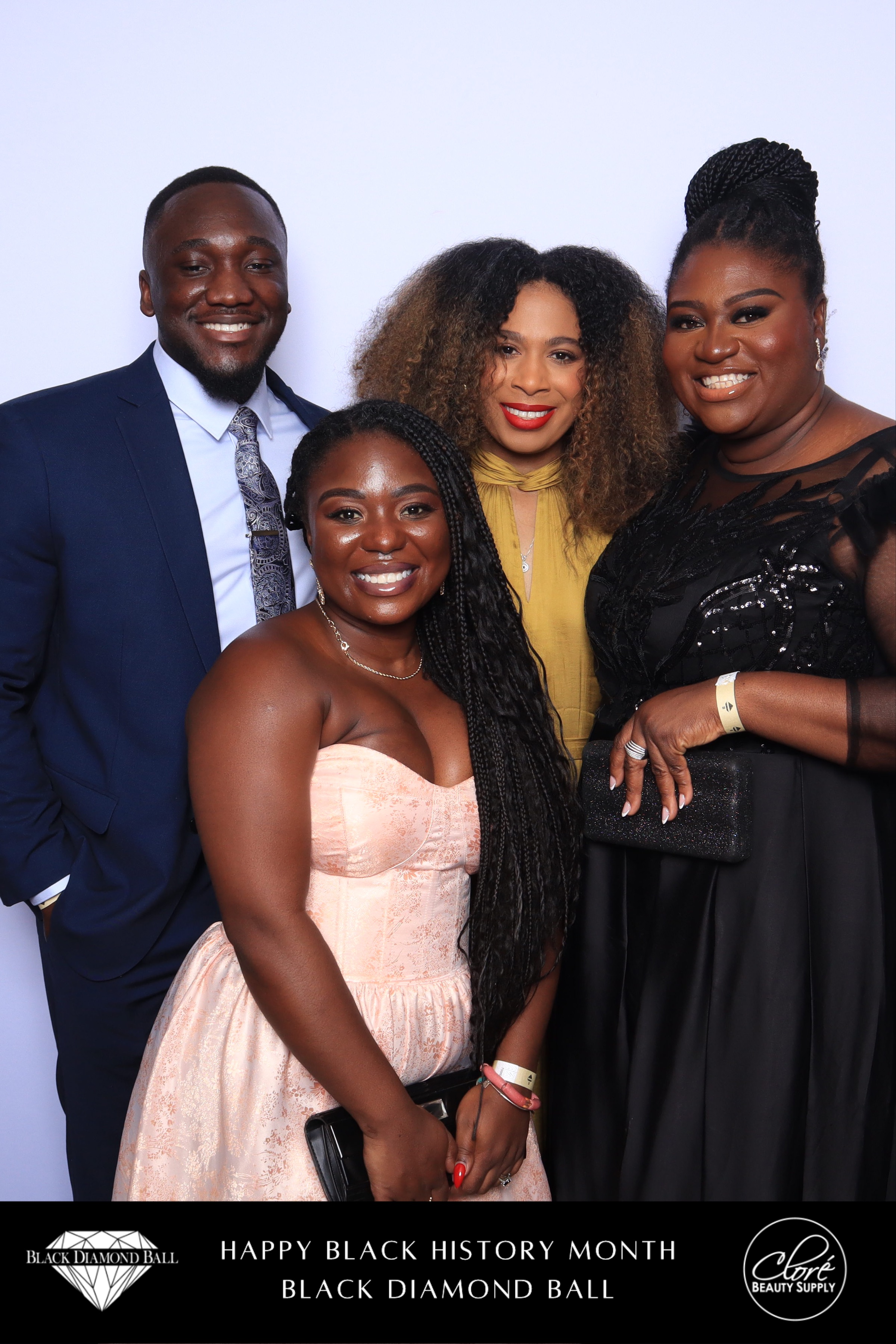 Gala guests networking at elegant event with warm lighting and formal attire